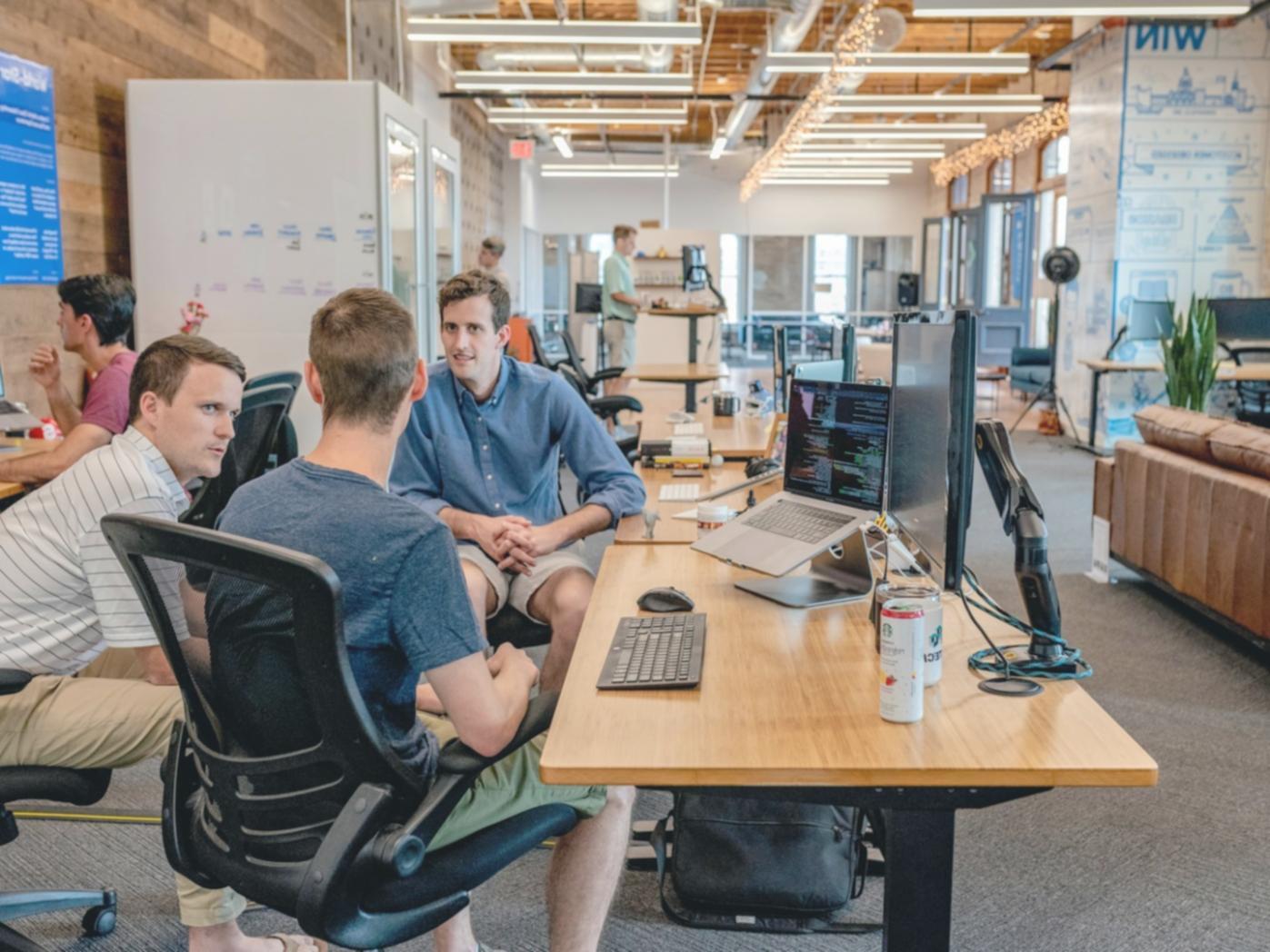 Game design wireframes and interaction flow sketches laid out on a desk